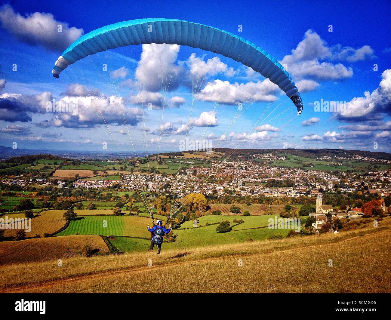 Paraglider launching Selsley Common Gloucestershire uk Stock Photo
