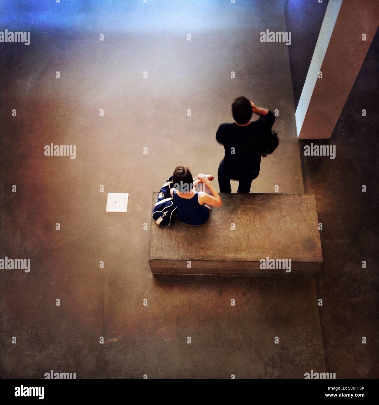 Couple hanging in modern building - Smartphone Captured Stock Image
