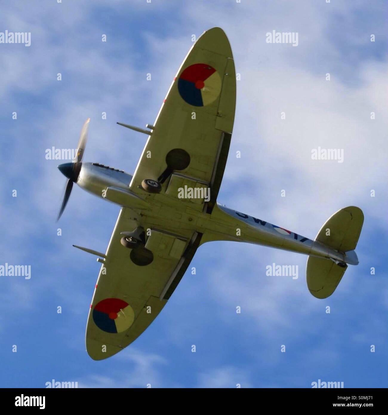 World War Two British Spitfire fighter aircraft with its landing gear down. Stock Photo