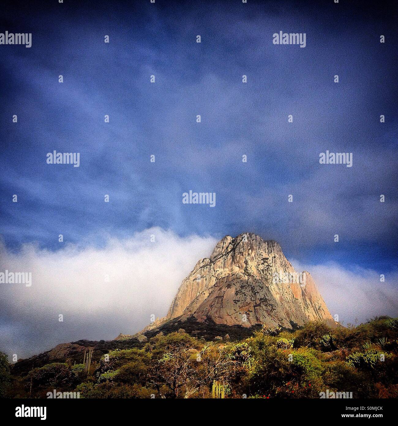 A picture of Peña de Bernal monolite rock seen from the Hostal Medieval, Peña de Bernal, Ezequiel Montes. Queretaro, Mexico - Smartphone Captured Stock Image