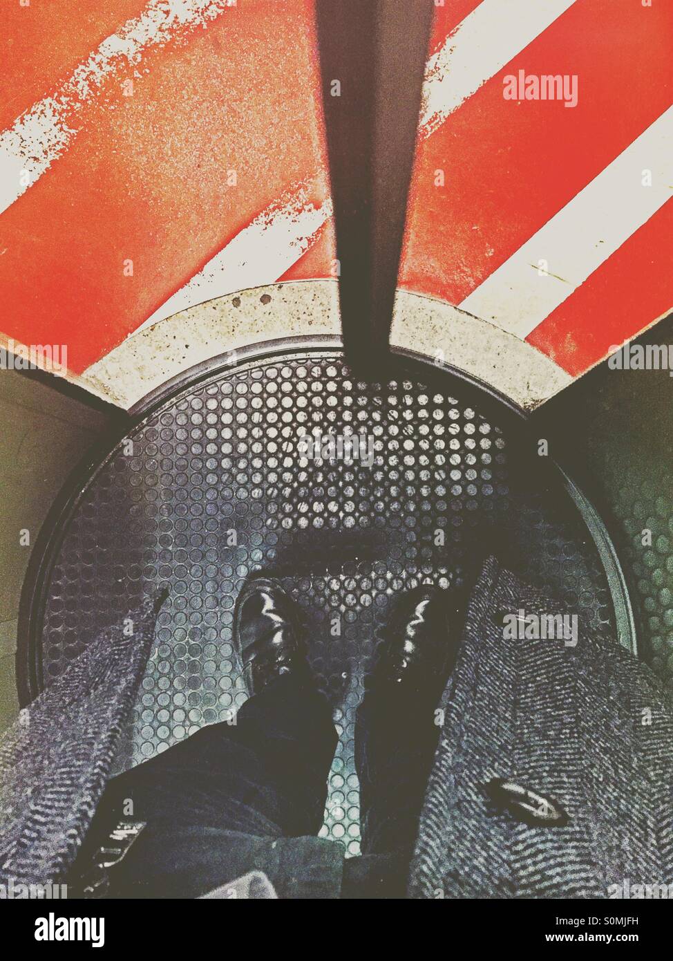 Business man standing in a circle lock access control gate. - Smartphone Captured Stock Image