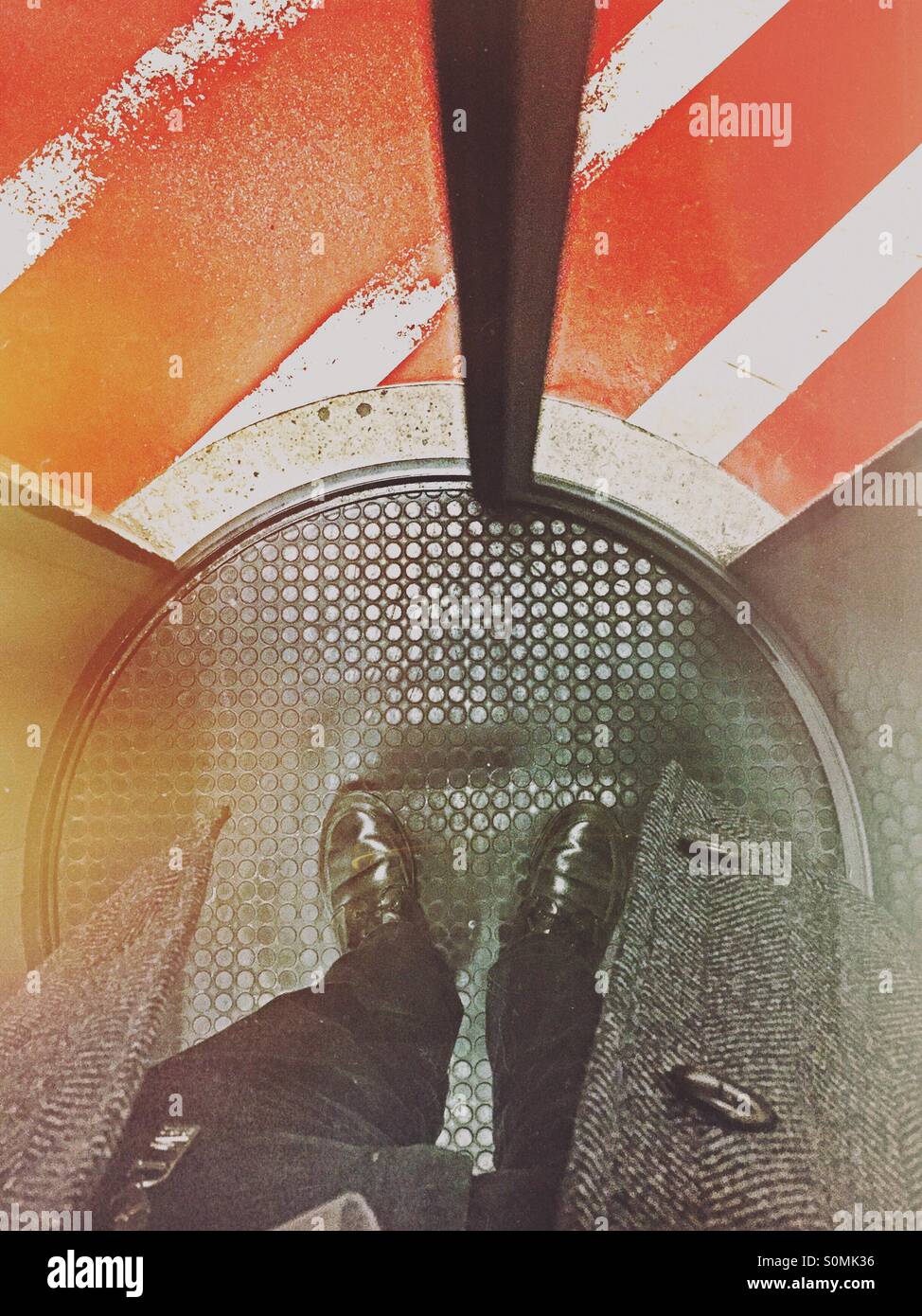 Business man standing in a circle lock access control gate. - Smartphone Captured Stock Image