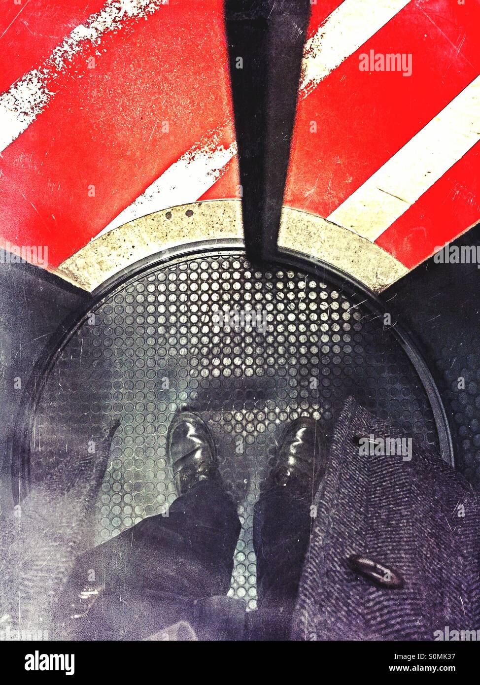 Business man standing in a circle lock access control gate. - Smartphone Captured Stock Image