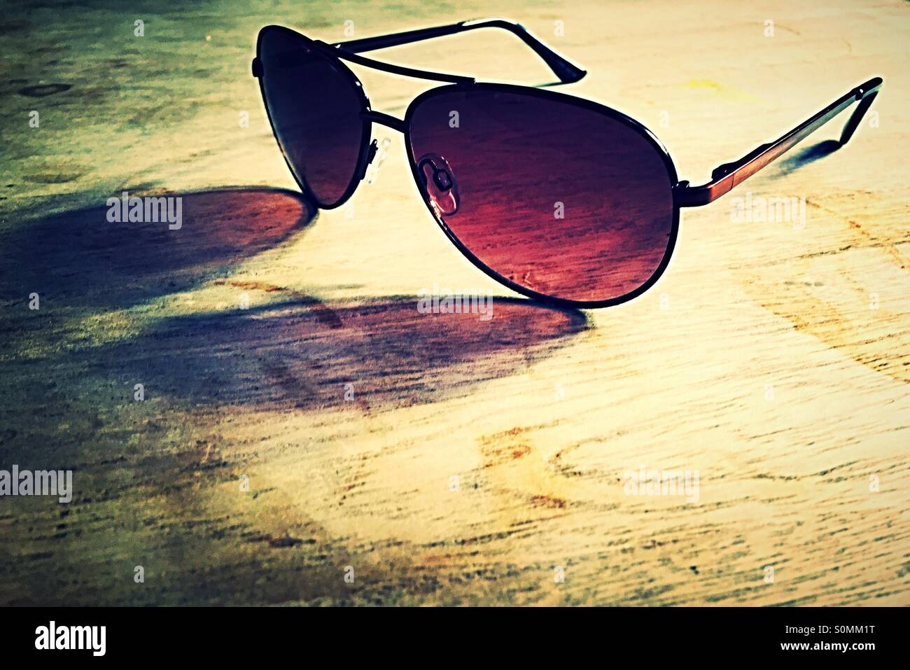Sunglasses on a wooden table Stock Photo