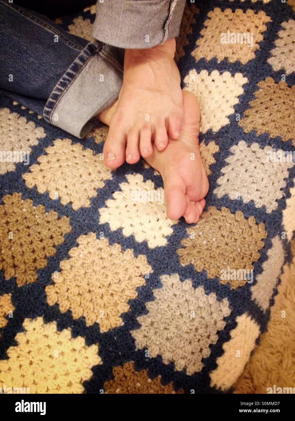 Feet on blanket Stock Photo Alamy