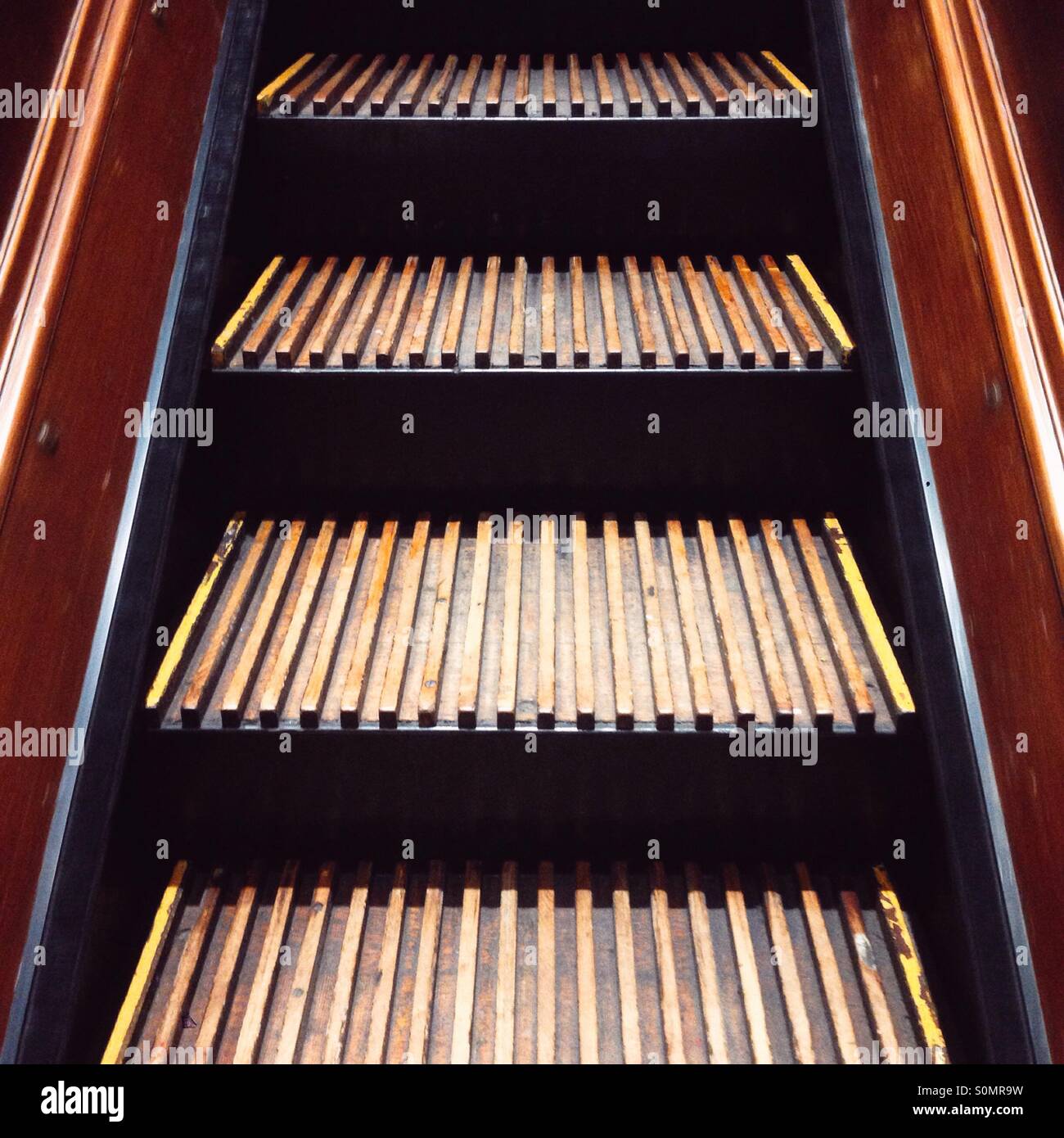 Wooden escalator in Macy's Department store, New York city United States of America. - Smartphone Captured Stock Image