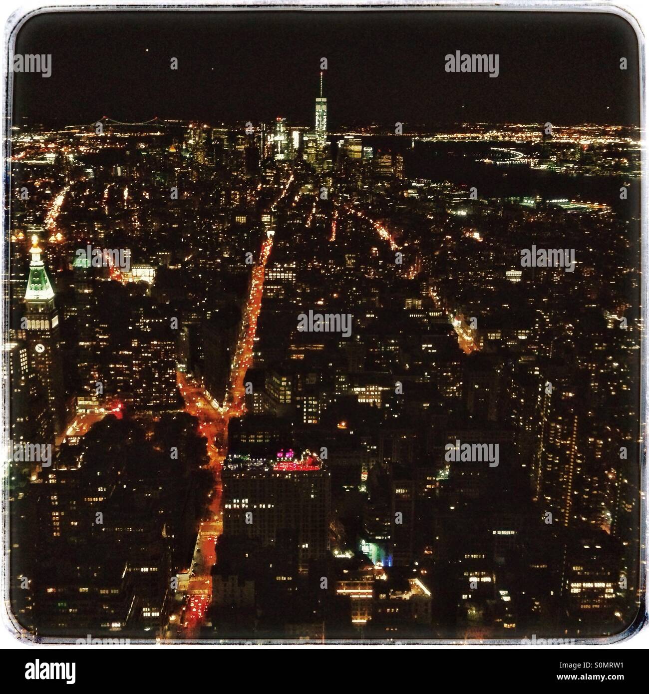 View from the top of the Empire State building at night looking towards the World Trade Centre, Manhattan, New York City, United States of America. - Smartphone Captured Stock Image