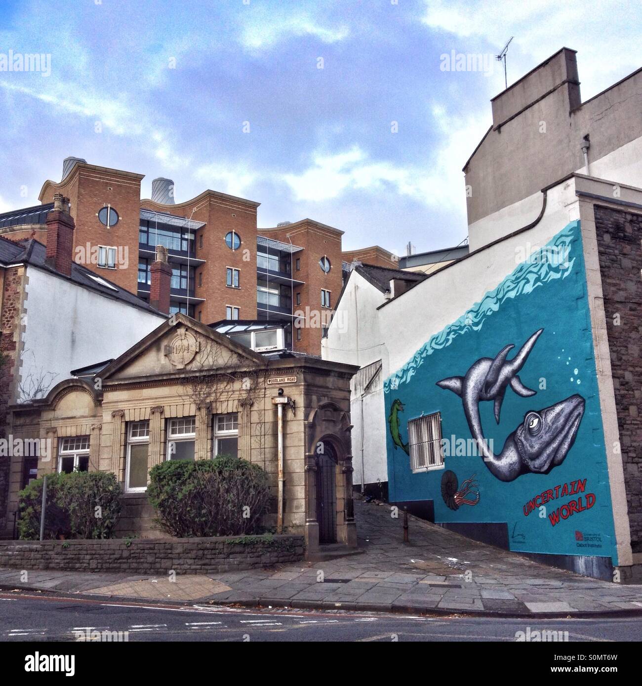 'Uncertain World', a mural by Alex Lucas alongside the Edwardian Cloakroom, an art gallery in Bristol, England - Smartphone Captured Stock Image