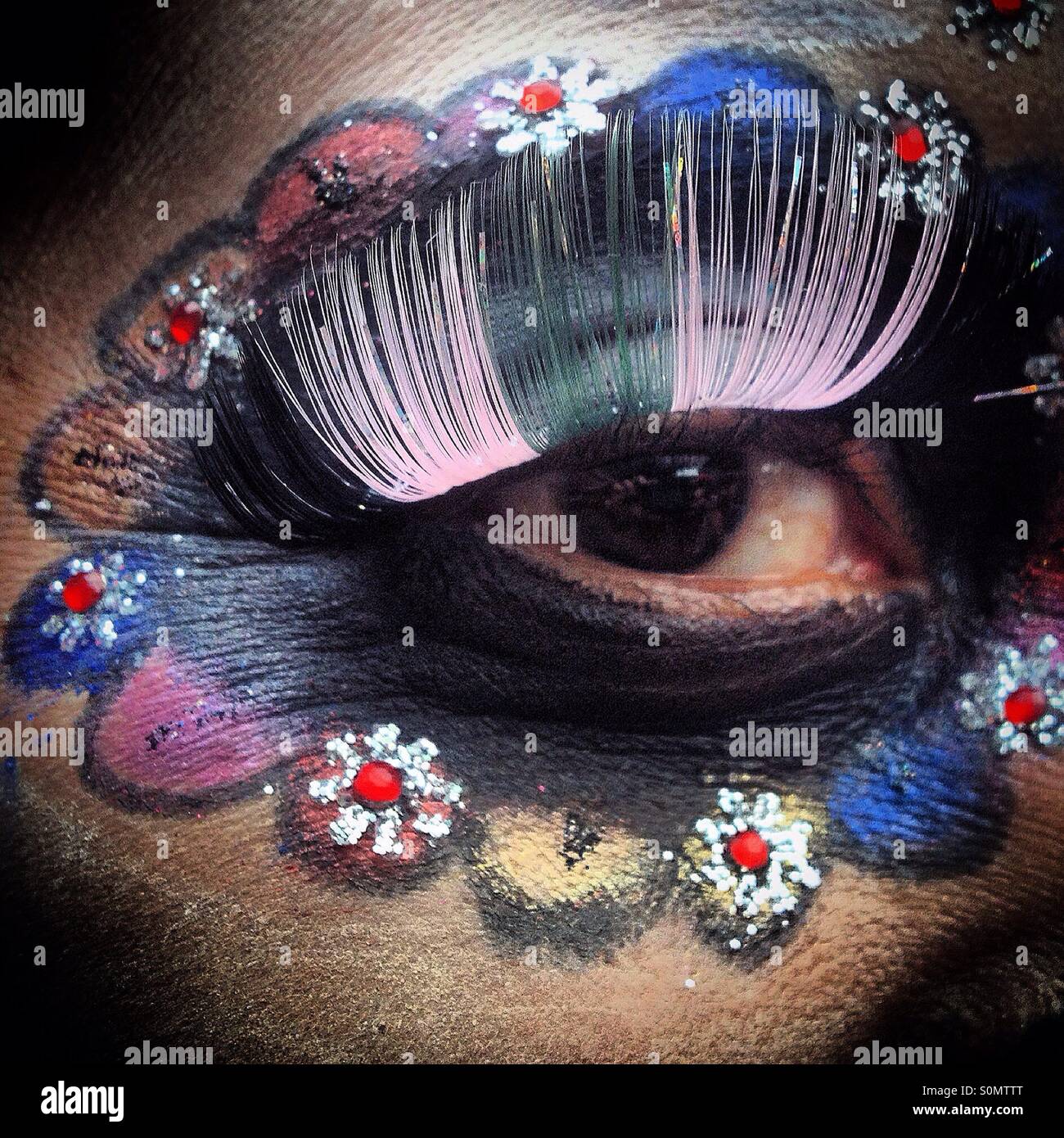 The eye of a Catrina decorated with flowers in Mexico City. The Day of the Dead celebration mixes Pre-Hispanic traditions with the European tradition of the Catholic All Souls Day. - Smartphone Captured Stock Image