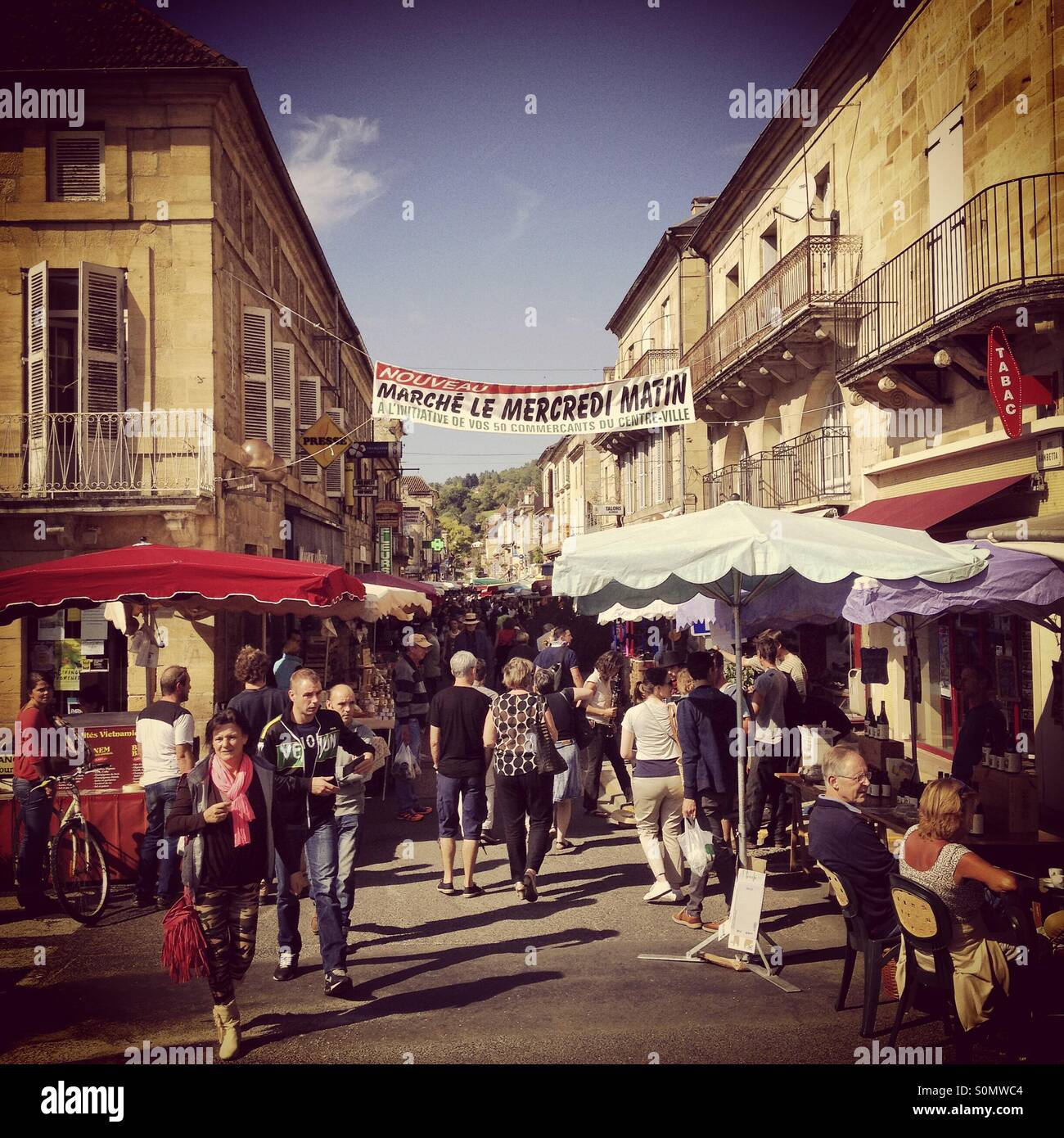 Sunday street market St Cyprien, Dordogne, France. Instagram style iPhone mobile phone photo. - Smartphone Captured Stock Image