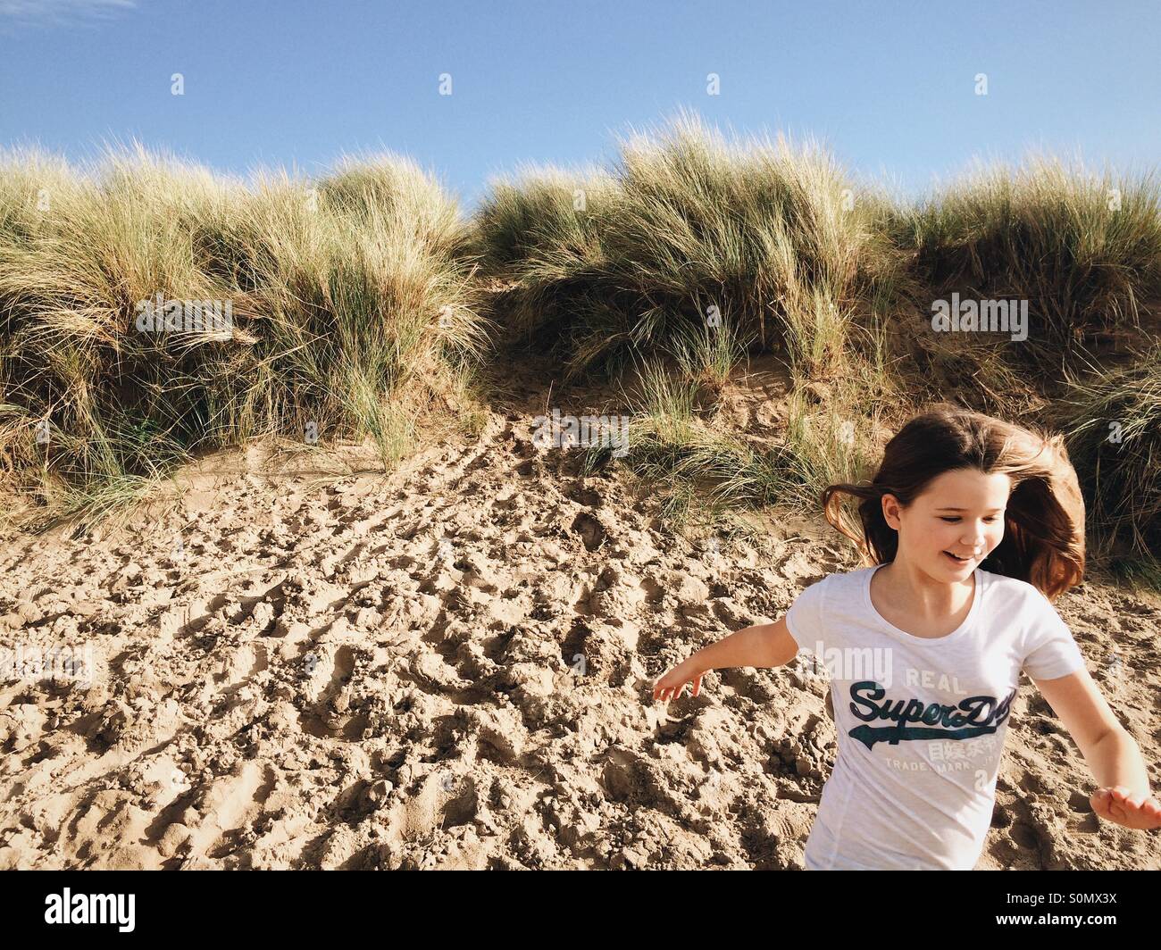 blond-girl-running-hi-res-stock-photography-and-images-alamy