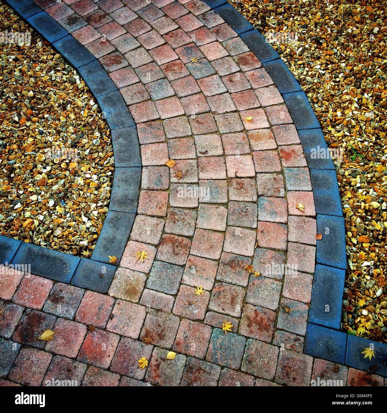 Curving brick path Stock Photo