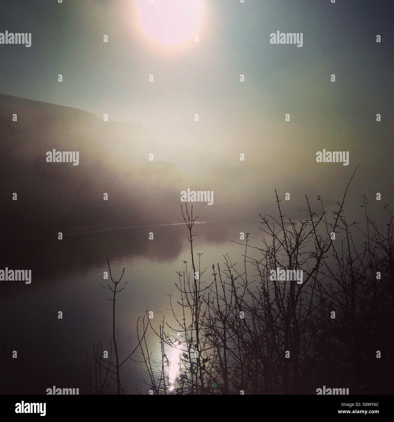 Sunrise over misty reservoir - Smartphone Captured Stock Image