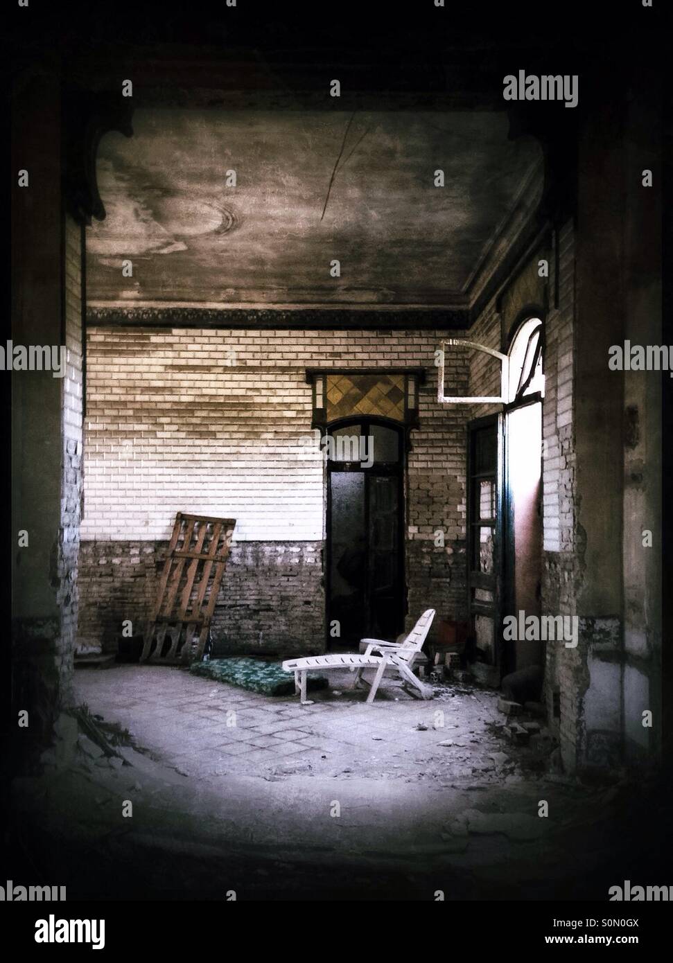 Sun-lounger in an abandoned railway station, Catalonia, Spain. - Smartphone Captured Stock Image