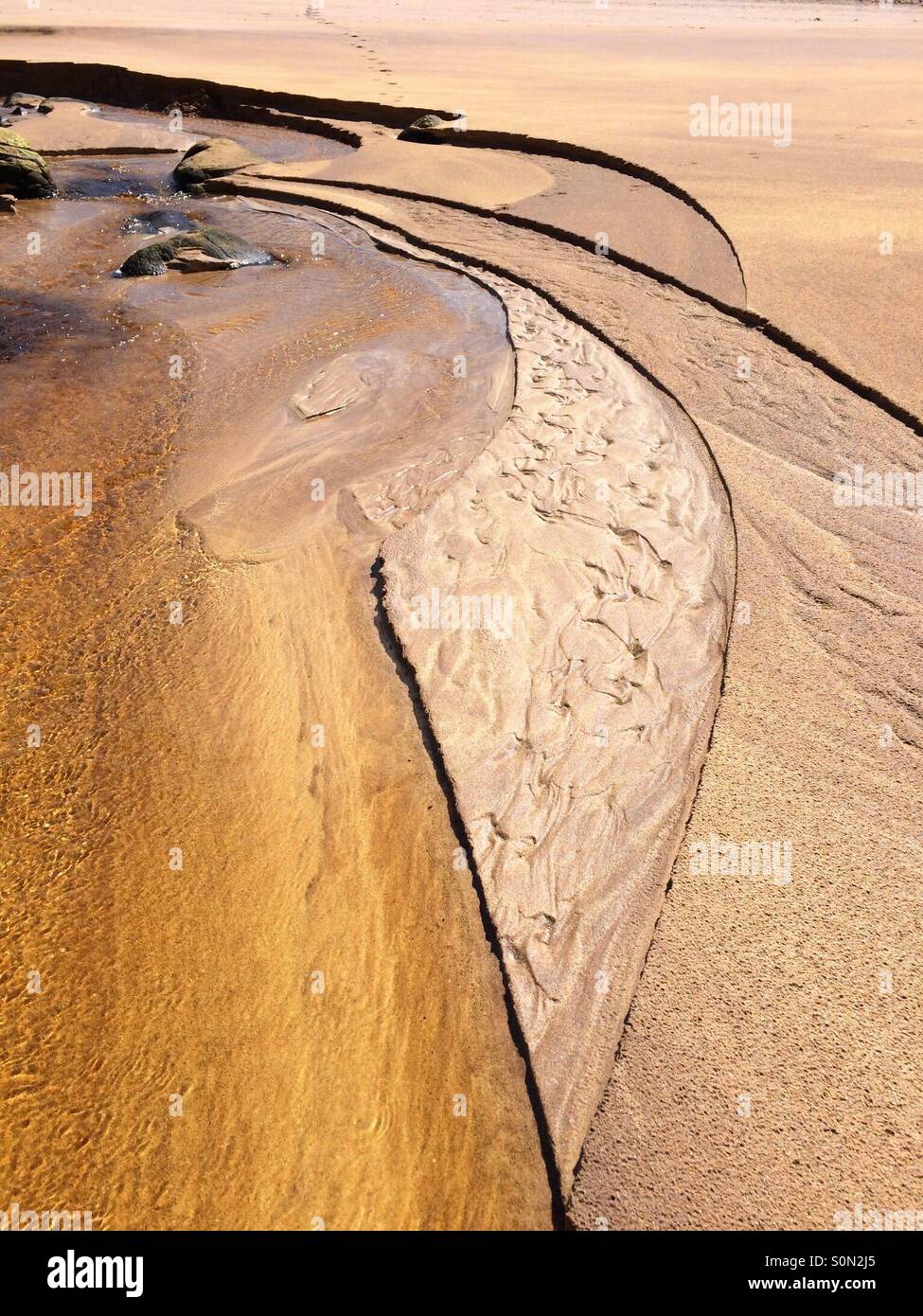 Beautiful detail of fluvial sculpture on sandy beach at Cape Wrath Scotland Stock Photo