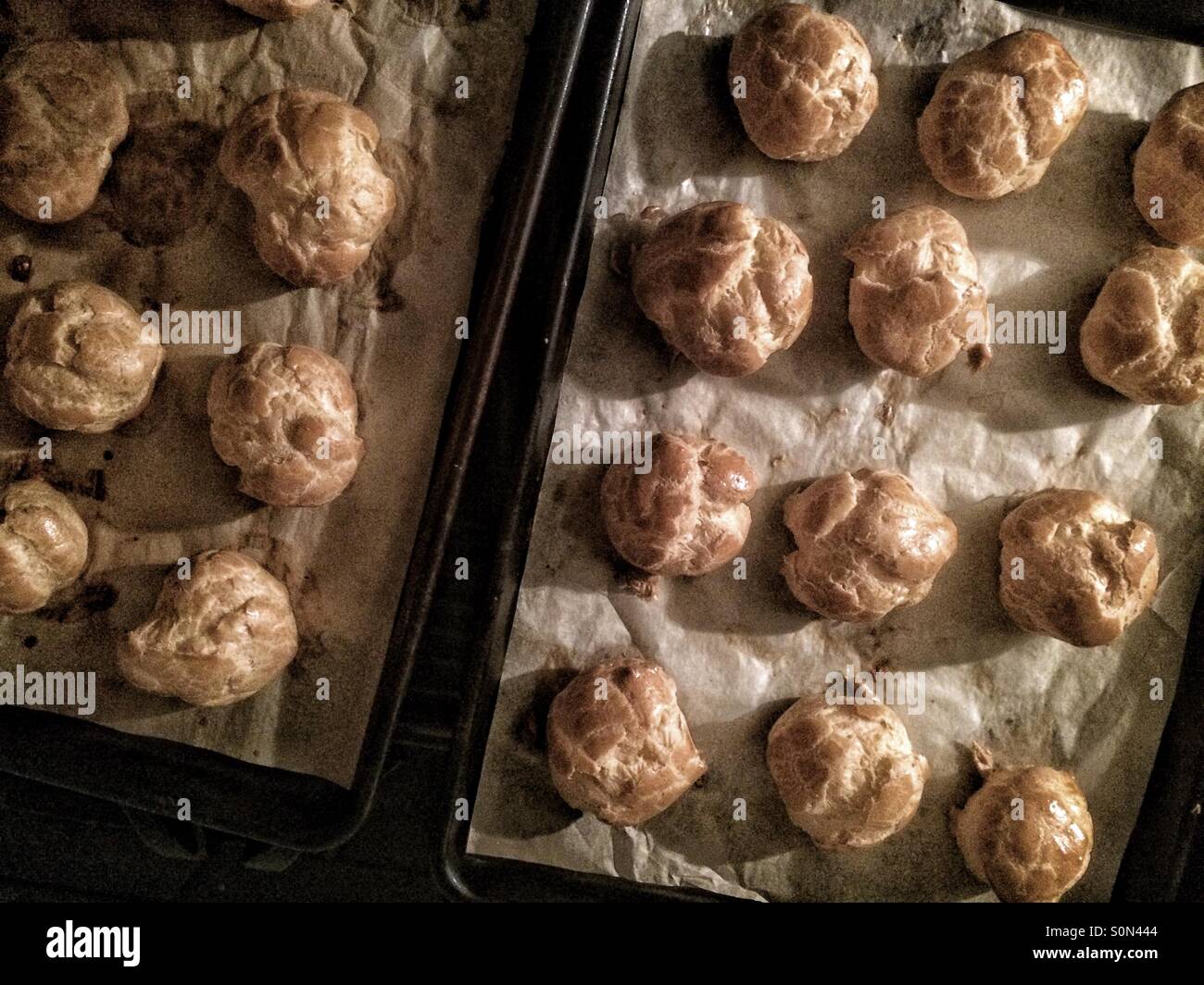 Cream puffs on baking sheet - Smartphone Captured Stock Image