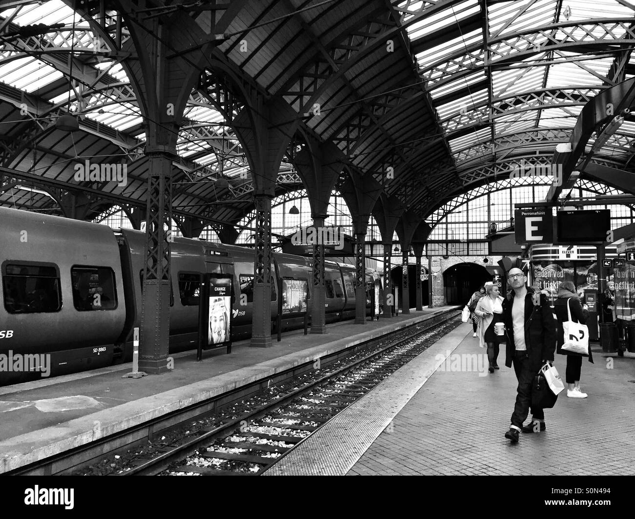 People in rush in the central train station of Copenhagen, Denmark - Smartphone Captured Stock Image