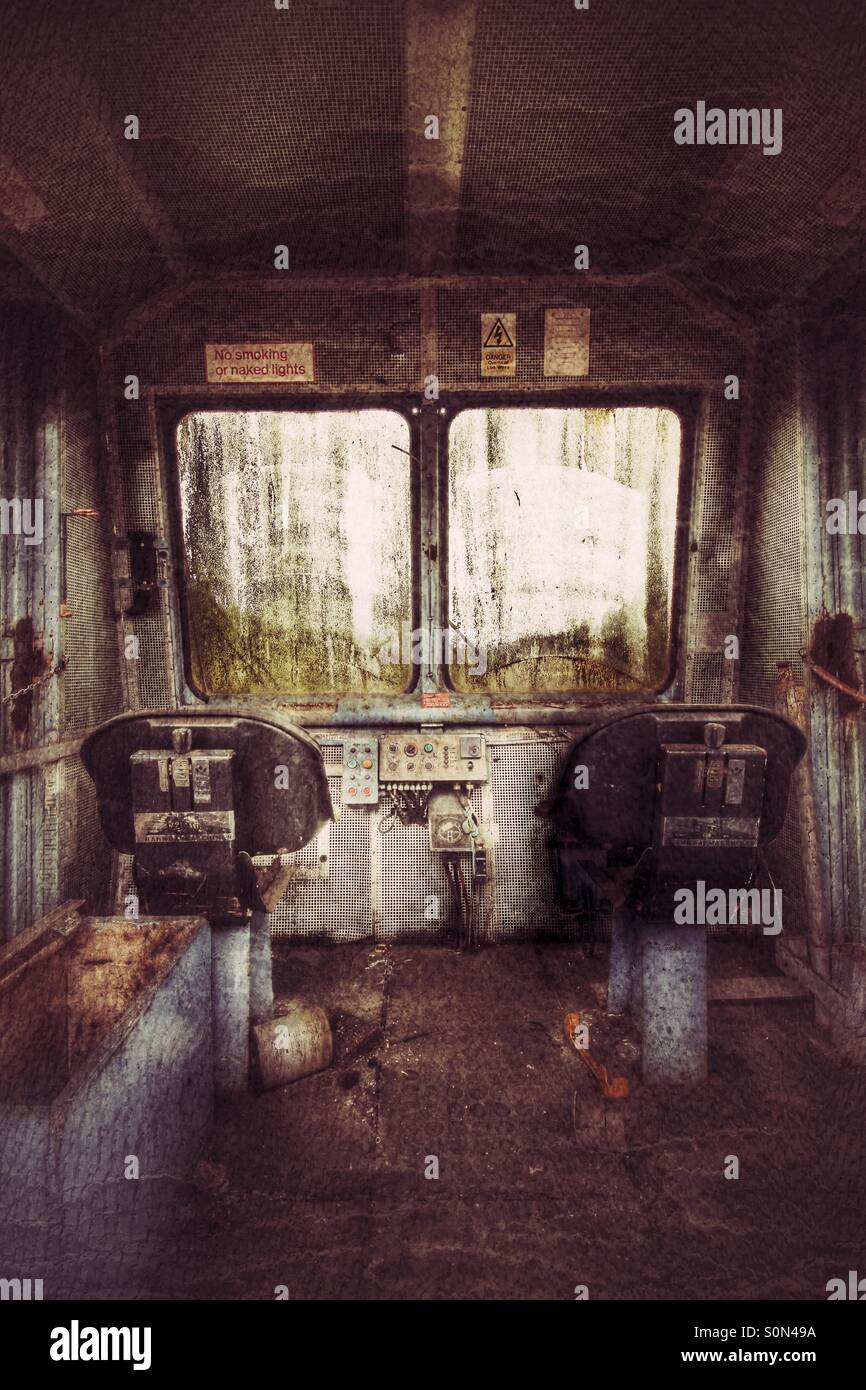 A derelict, abandoned locomotive cab in a disused state of repair. - Smartphone Captured Stock Image