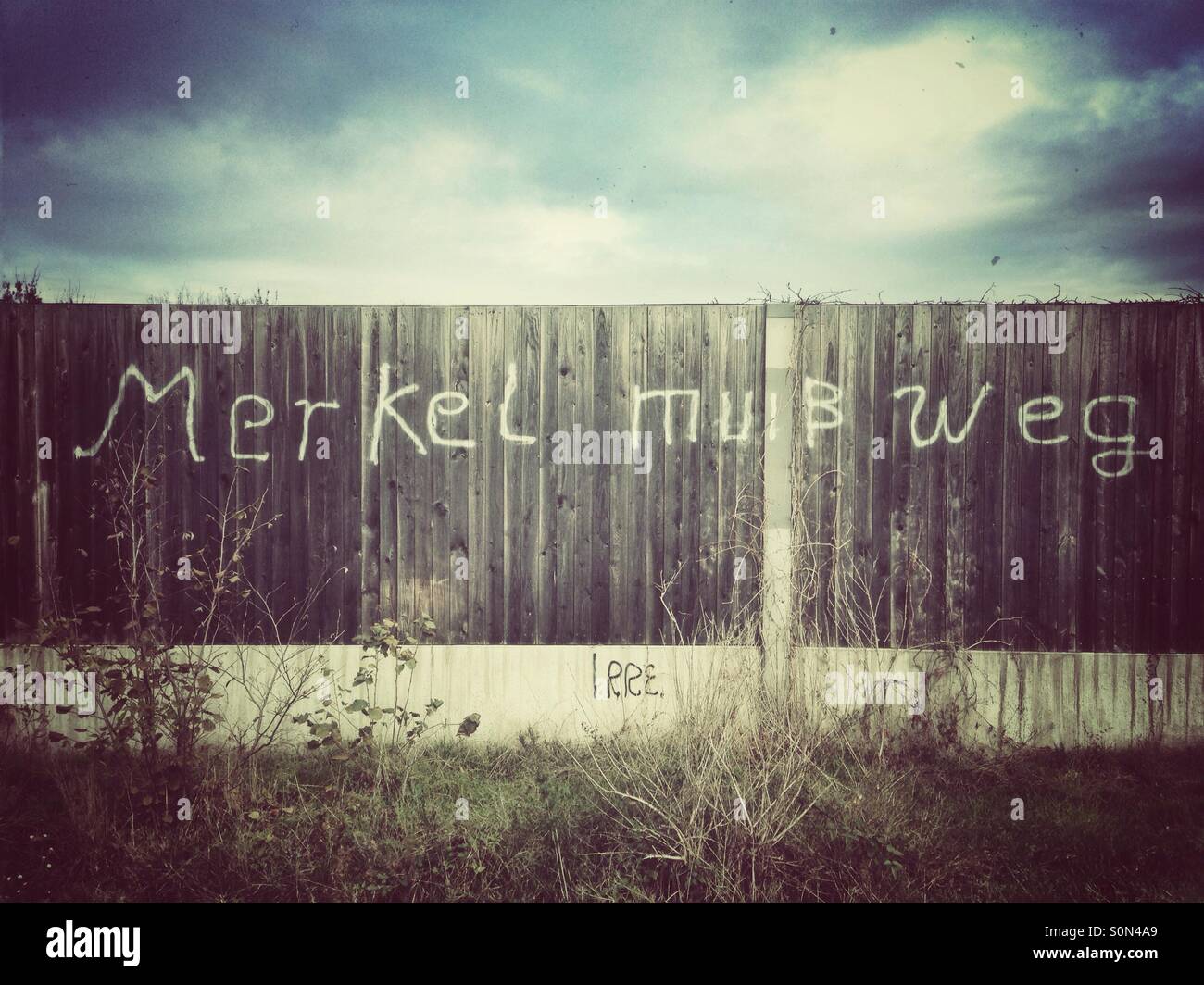 Merkel has to go graffiti in Berlin, Germany - Smartphone Captured Stock Image