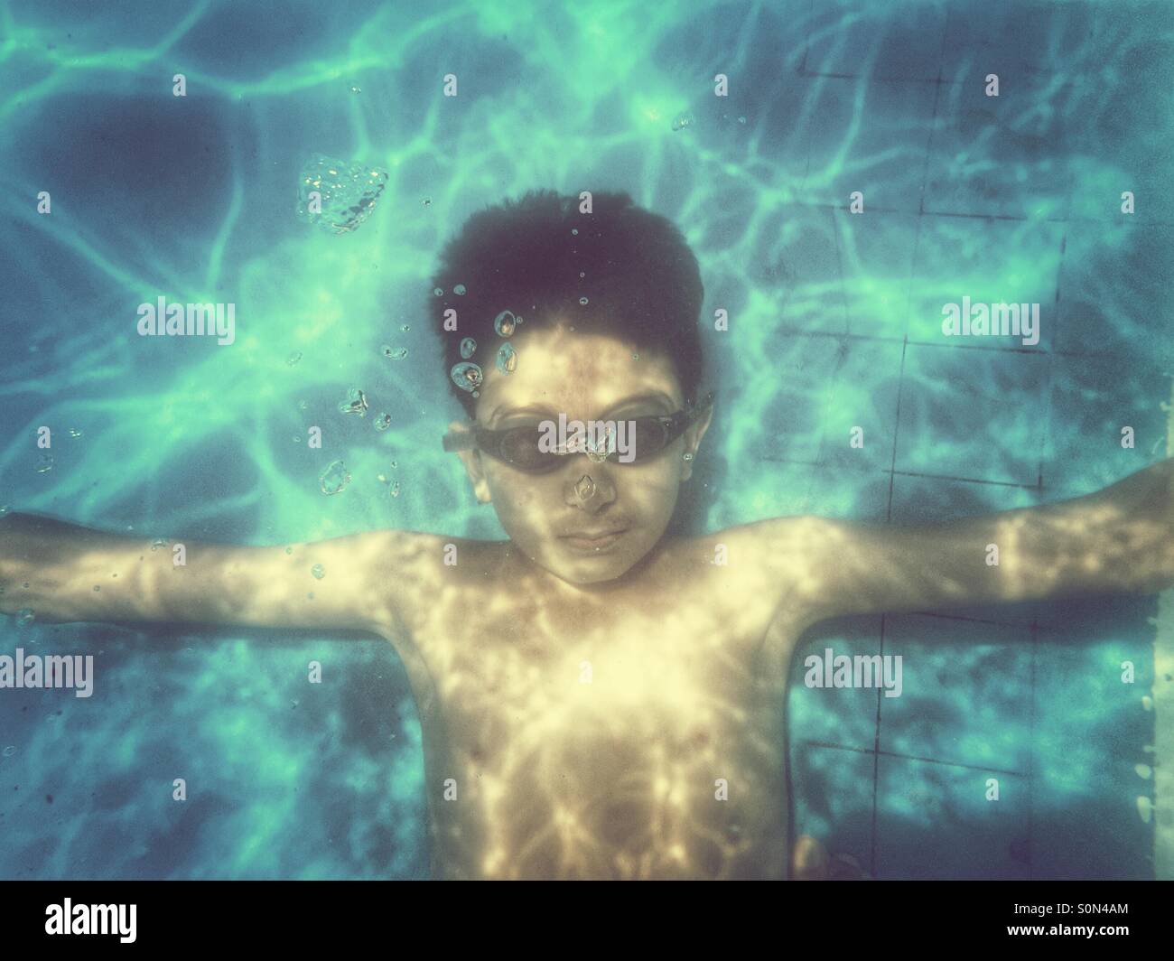 Boy Swimming Underwater In Pool High Resolution Stock Photography and ...