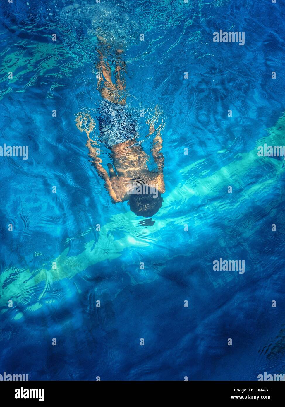 Boy swimming underwater in the pool Beirut Lebanon Middle East Stock Photo