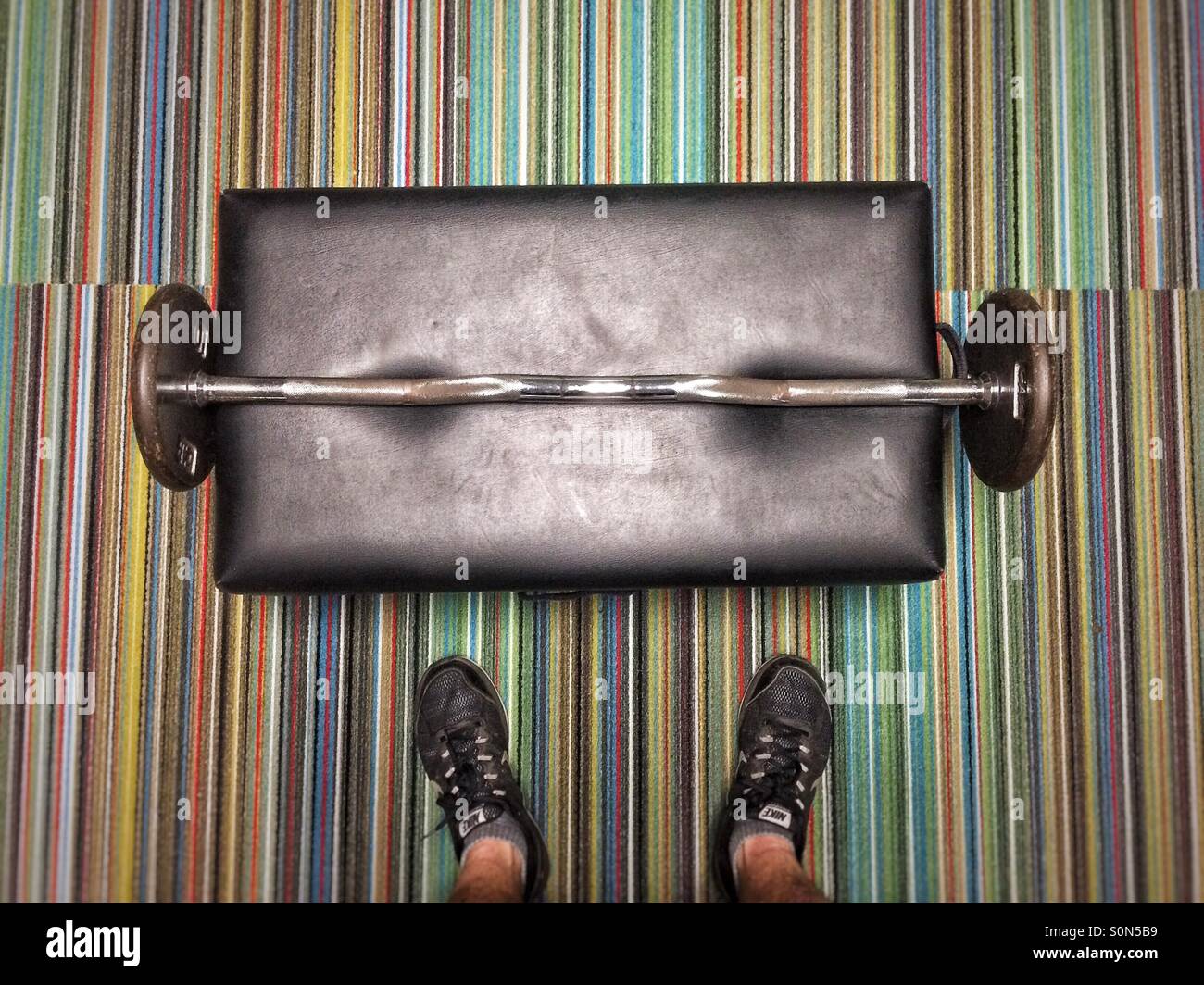 Man before barbell at gym - Smartphone Captured Stock Image
