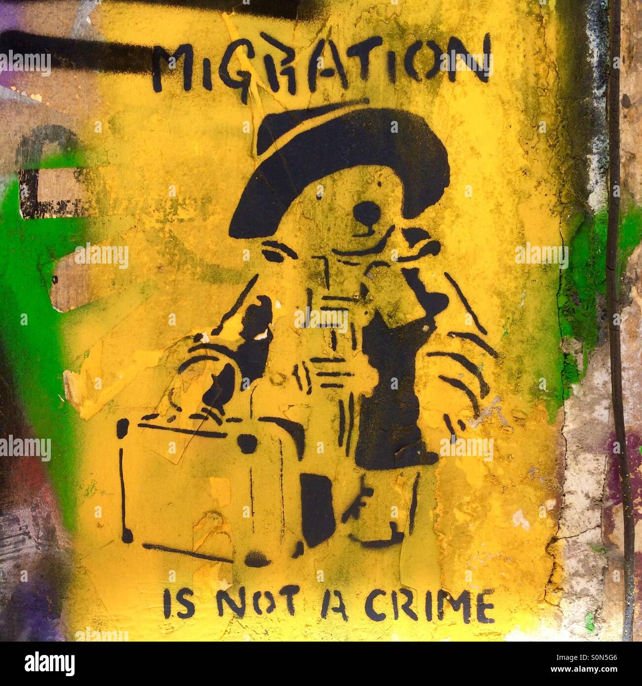 Timely and political Paddington Bear street art in Athens, Greece, with the message 'Migration is not a crime'. - Smartphone Captured Stock Image