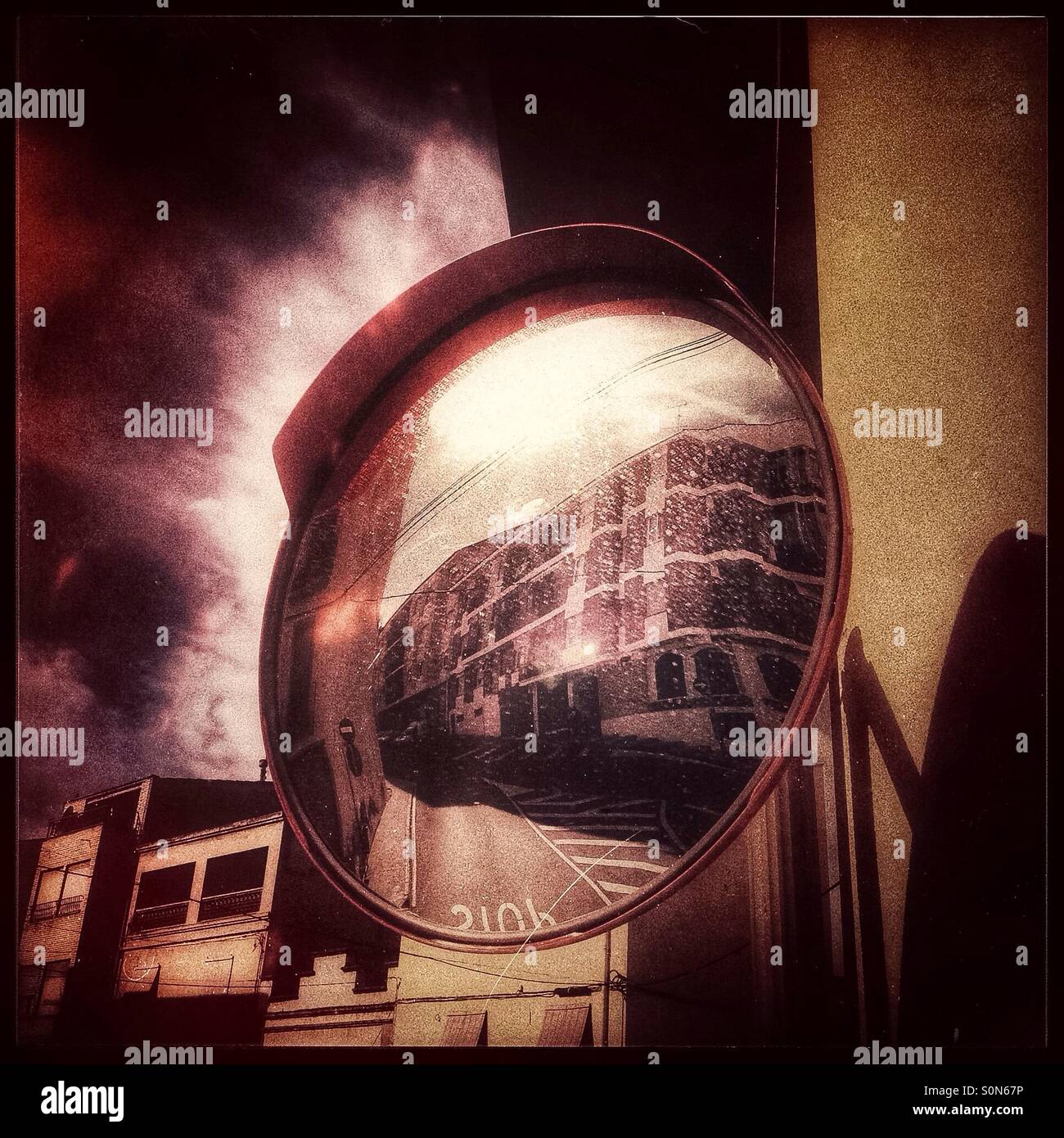 Street scene reflecting in a mirror, Mora d'Ebre, Spain. - Smartphone Captured Stock Image