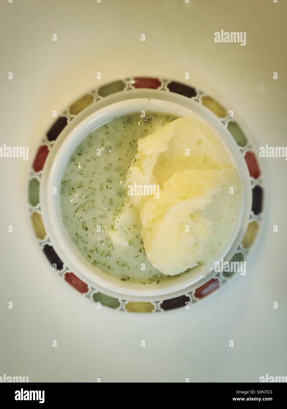Top view of potato mash and liquor - traditional London East End food - Smartphone Captured Stock Image