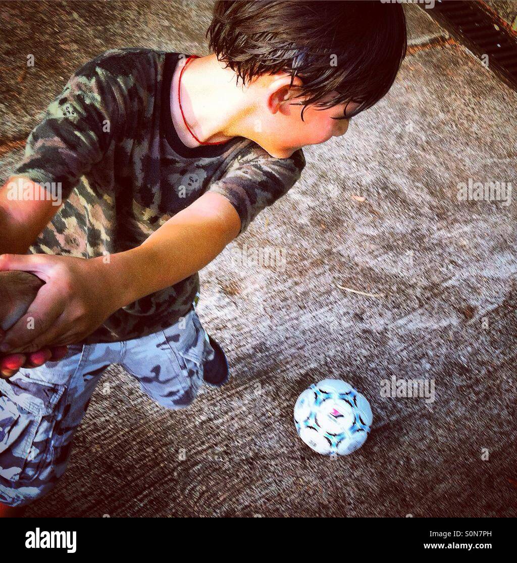 Kid plays soccer or football - Smartphone Captured Stock Image