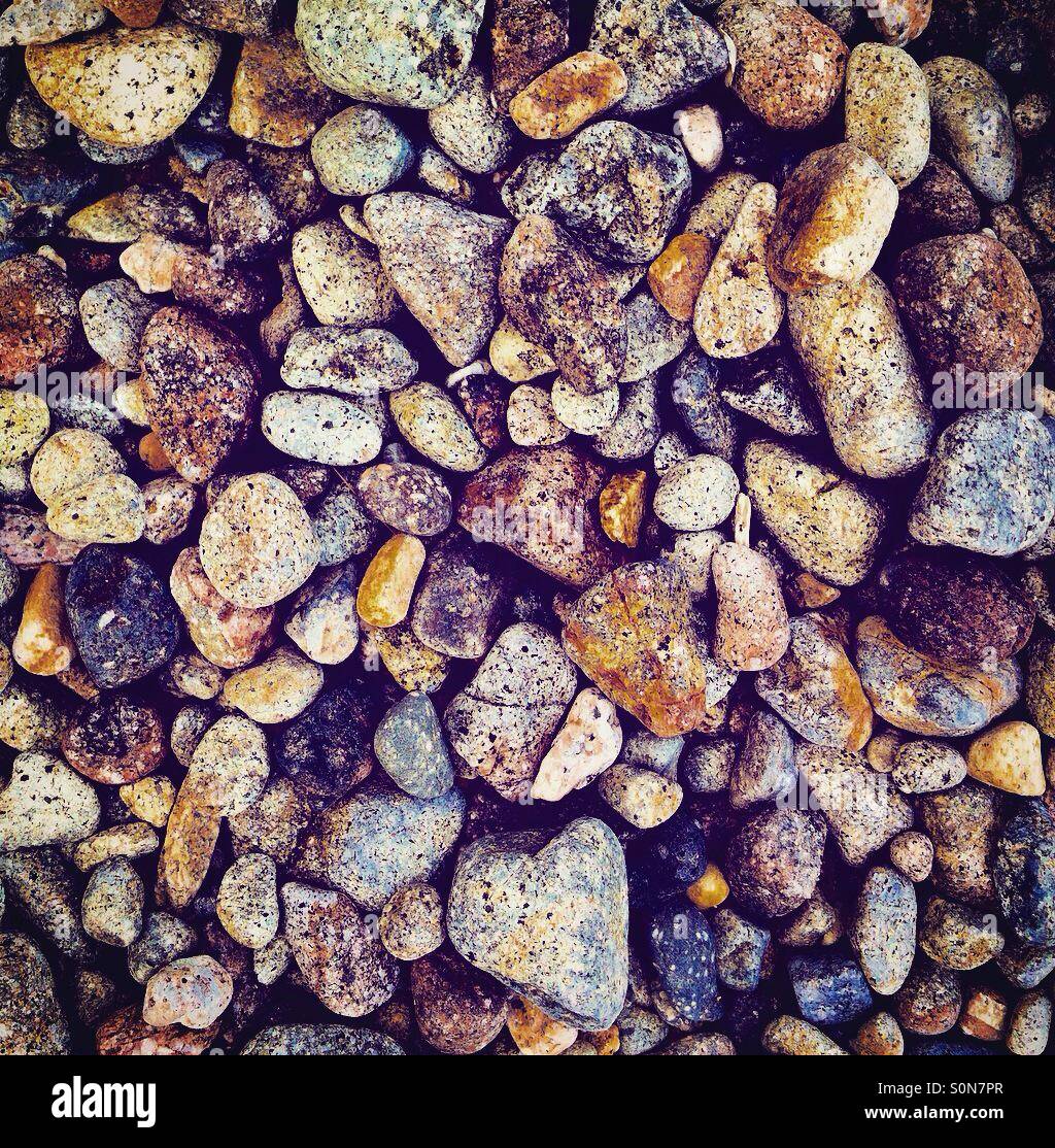Gallets rock stones on the beach top view - Smartphone Captured Stock Image