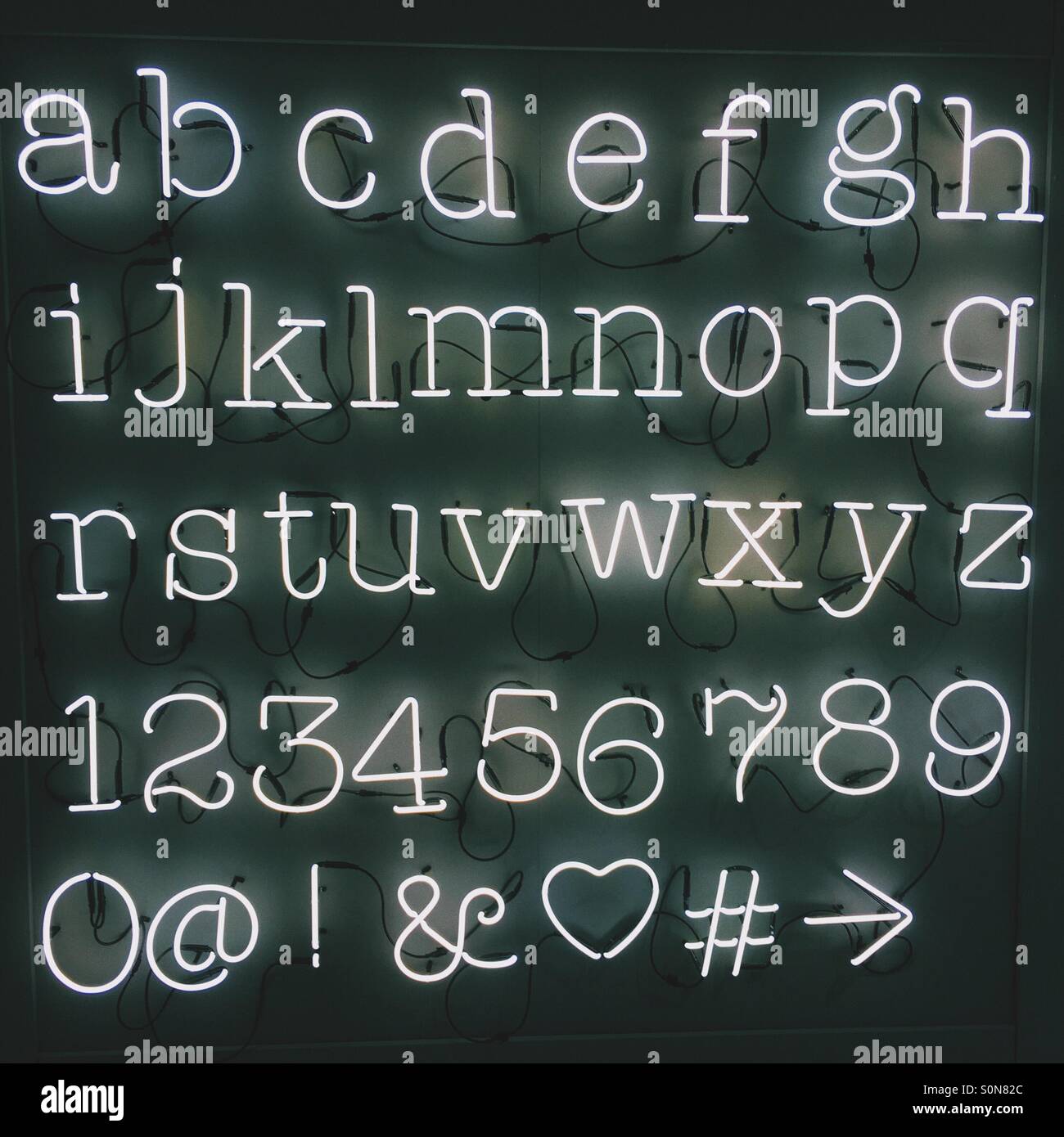 Neon lights spelling out the alphabet Stock Photo Alamy