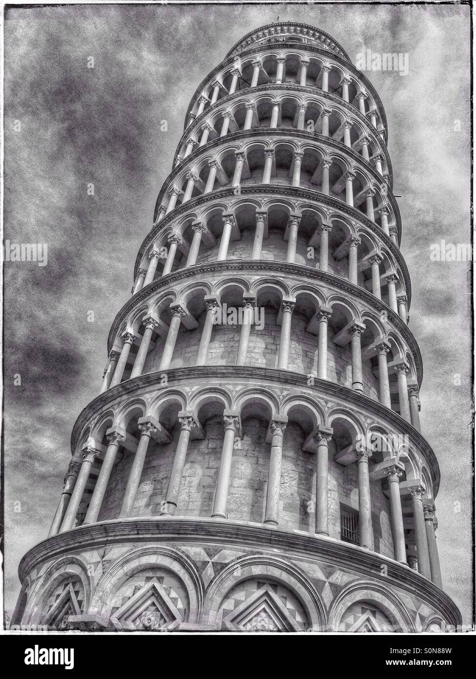 A Monochrome Image of The Leaning Tower Pisa in The Field of Miracles, Pisa, Tuscany, Italy. Photo Credit - © COLIN HOSKINS. - Smartphone Captured Stock Image