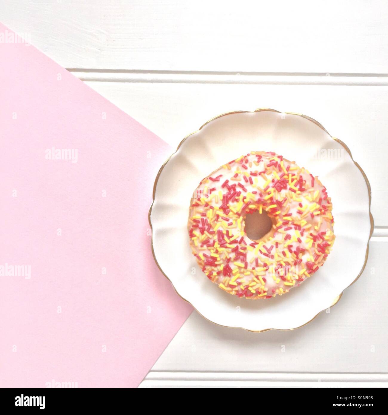 Doughnut with yellow and pink sprinkles - Smartphone Captured Stock Image