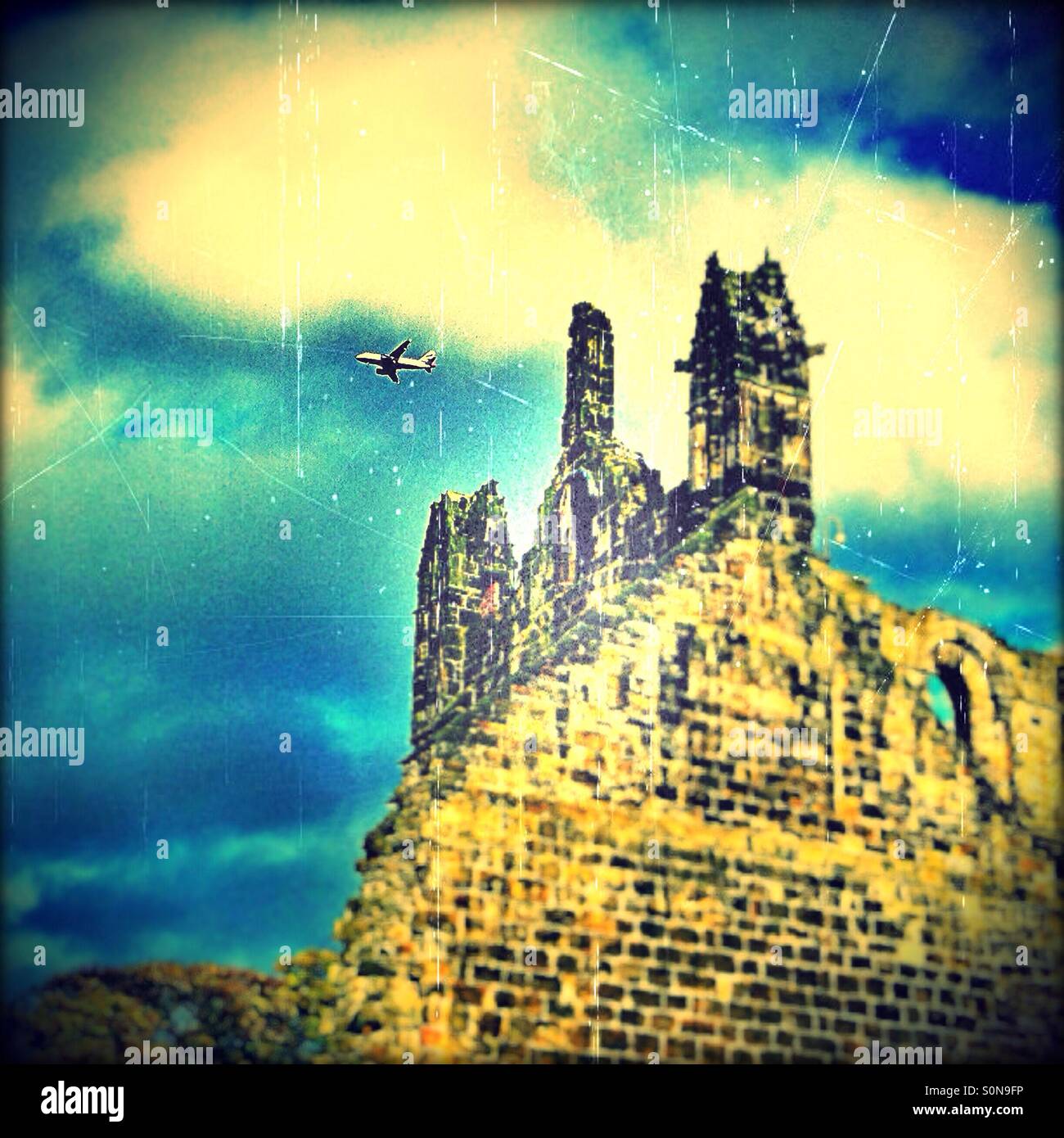 Plane flying over Kirkstall Abbey ruins, Leeds, West Yorkshire, England, United Kingdom, Europe Stock Photo