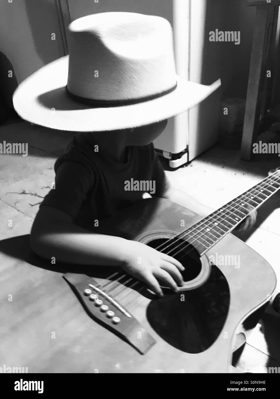 Cowboy and his guitar Stock Photo Alamy