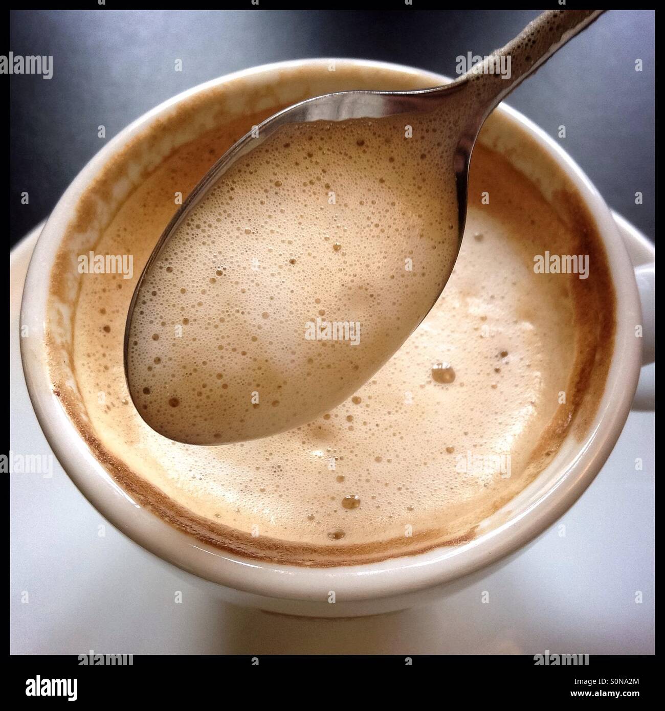 Café con leche [fresh coffee with milk], Catalonia, Spain. - Smartphone Captured Stock Image