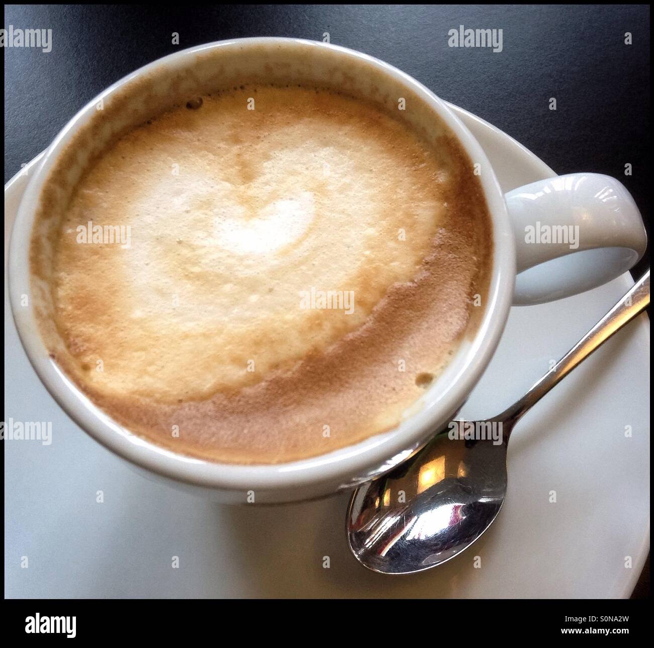 Café con leche [fresh coffee with milk], Catalonia, Spain. - Smartphone Captured Stock Image