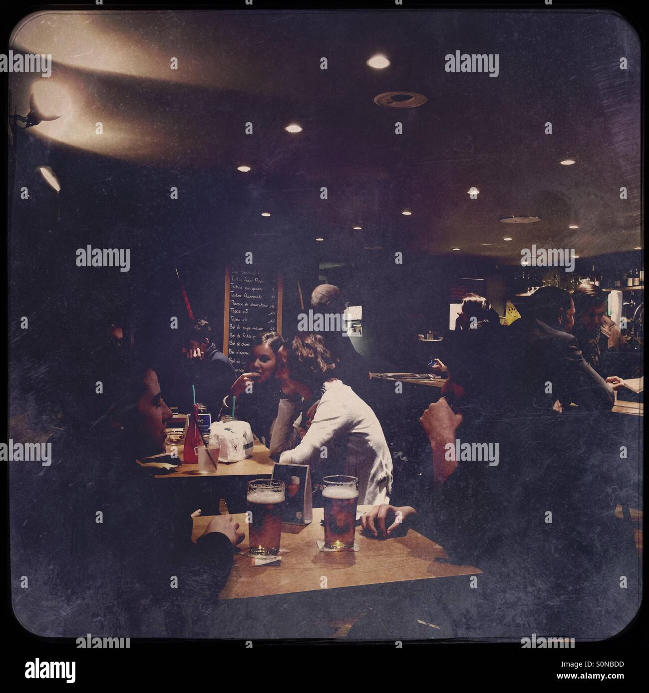 Young people drinking beer France - Smartphone Captured Stock Image
