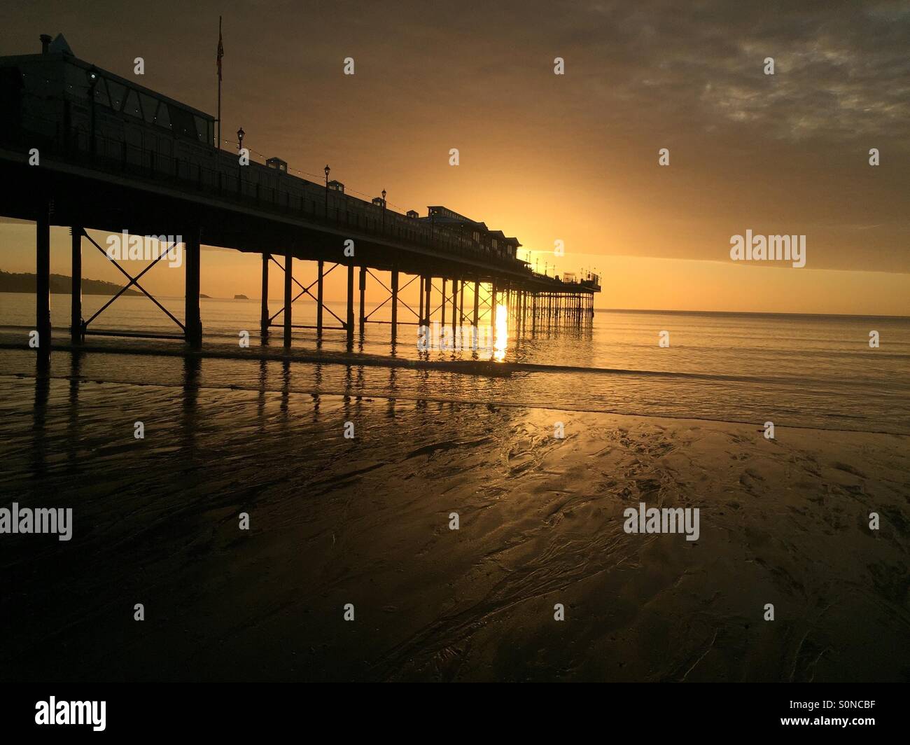 Sunrise at Paignton beach Stock Photo
