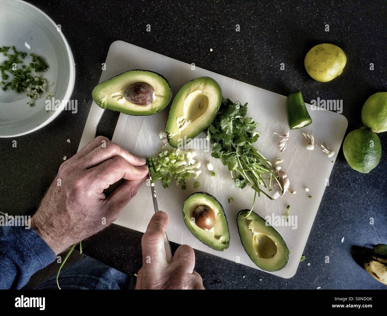 Man making guacamole Stock Photo