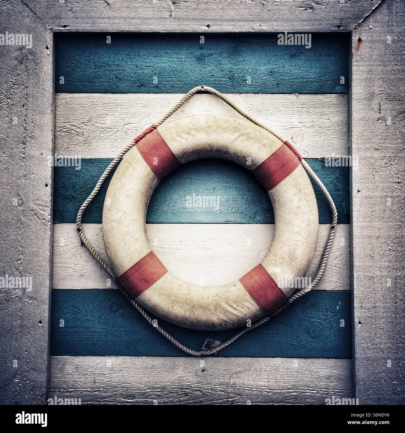 Nautical lifebouy on wooden background Stock Photo