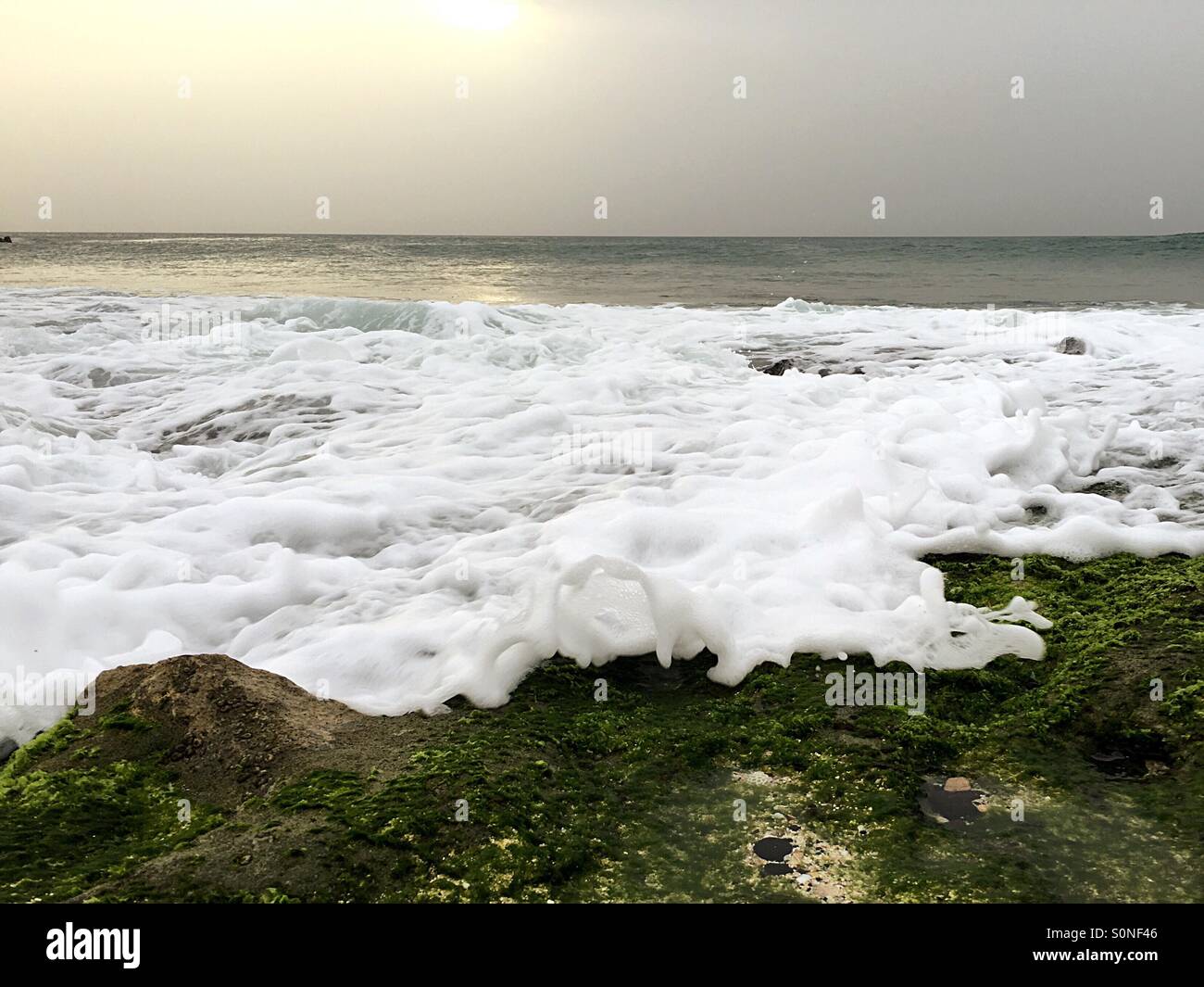 Waves coming in over rocks - Smartphone Captured Stock Image