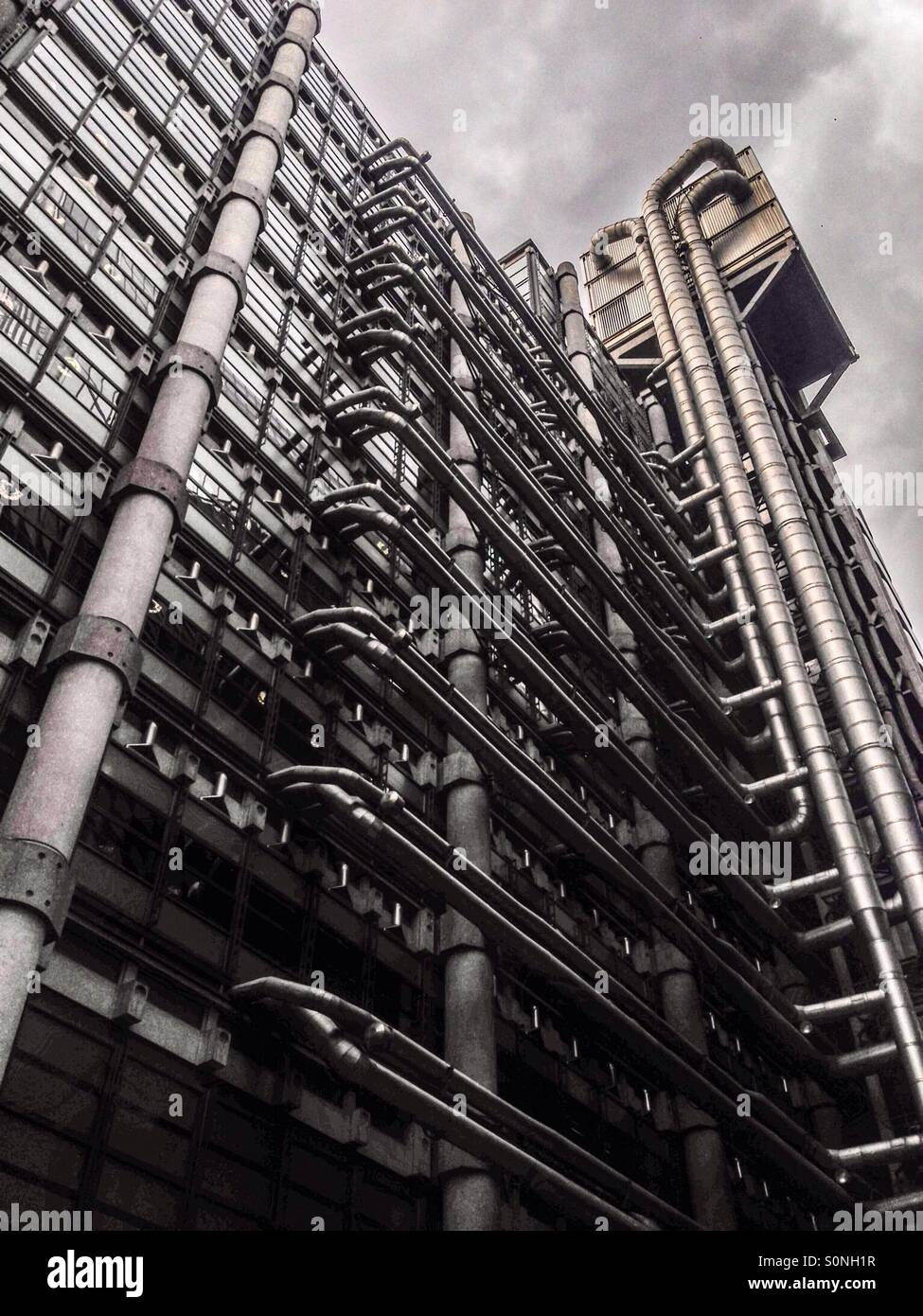 The Lloyds building, sometimes known as the inside out building is home of the insurance institution Lloyds of London. It is located on the former site of East India House in Lime Street, London. Stock Photo