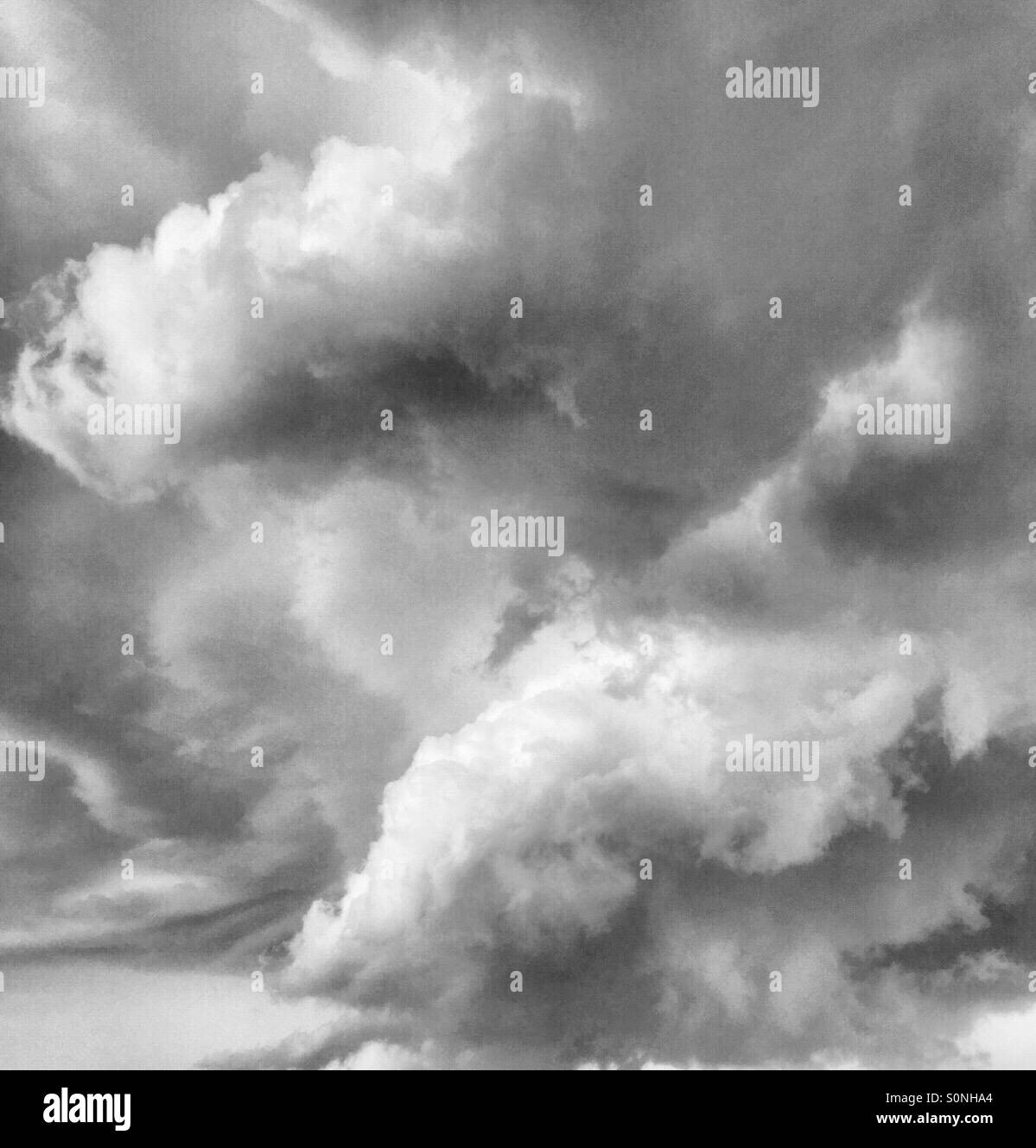 Thunder clouds grey and white threatening stormy weather Stock Photo