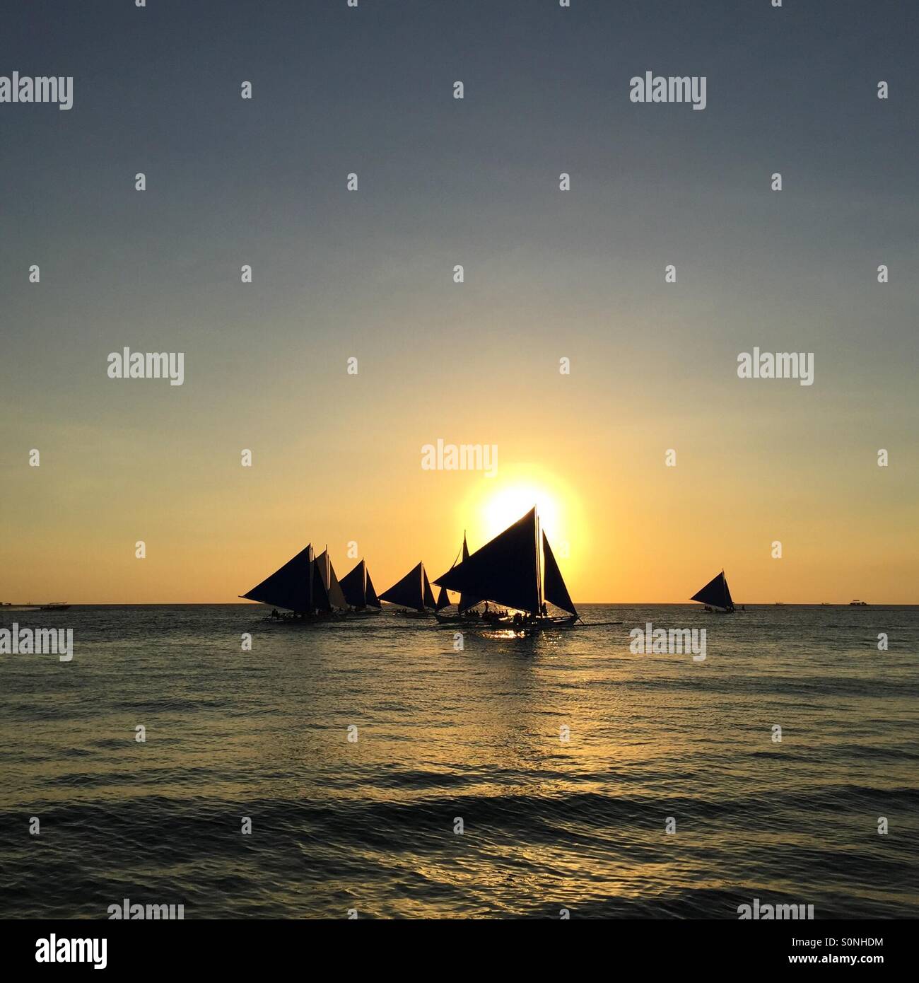 Sunset with sailing boats hi-res stock photography and images - Alamy