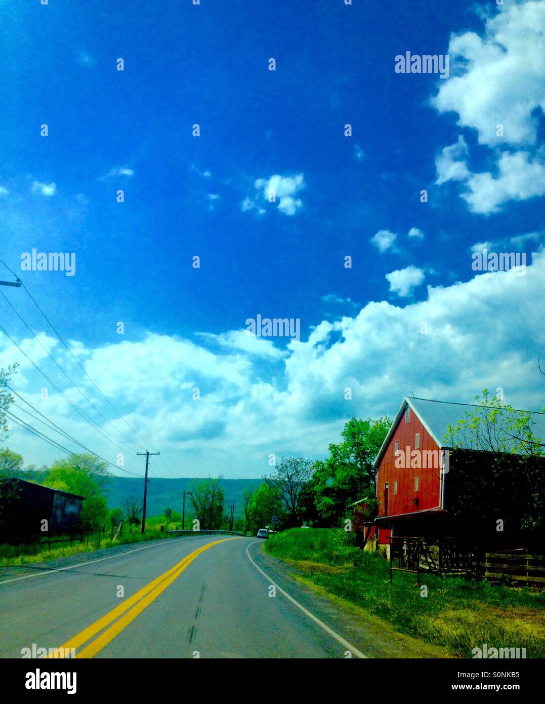 Red Barn on a Country Road Stock Photo - Alamy