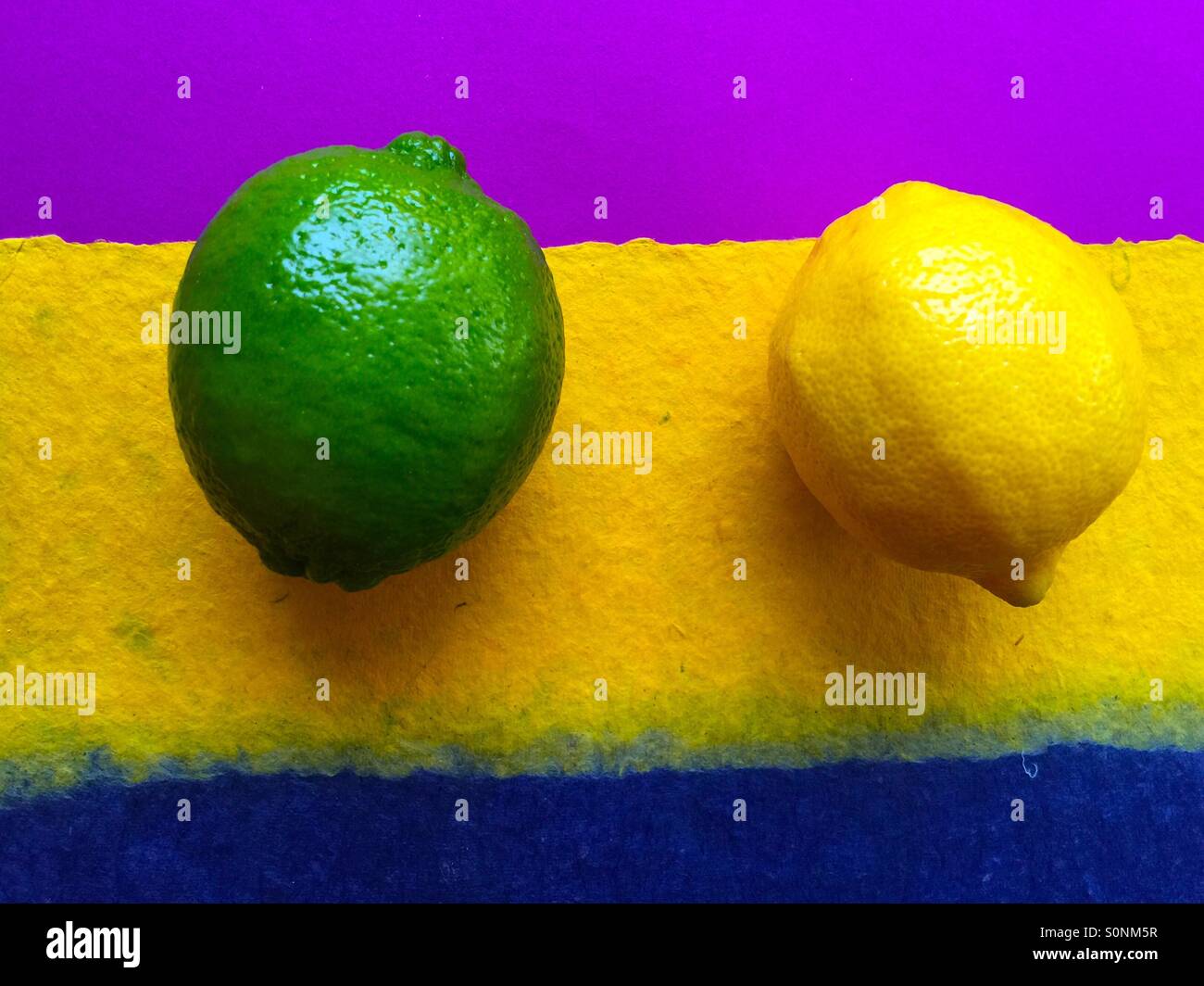 Lime and lemon on colored background - Smartphone Captured Stock Image