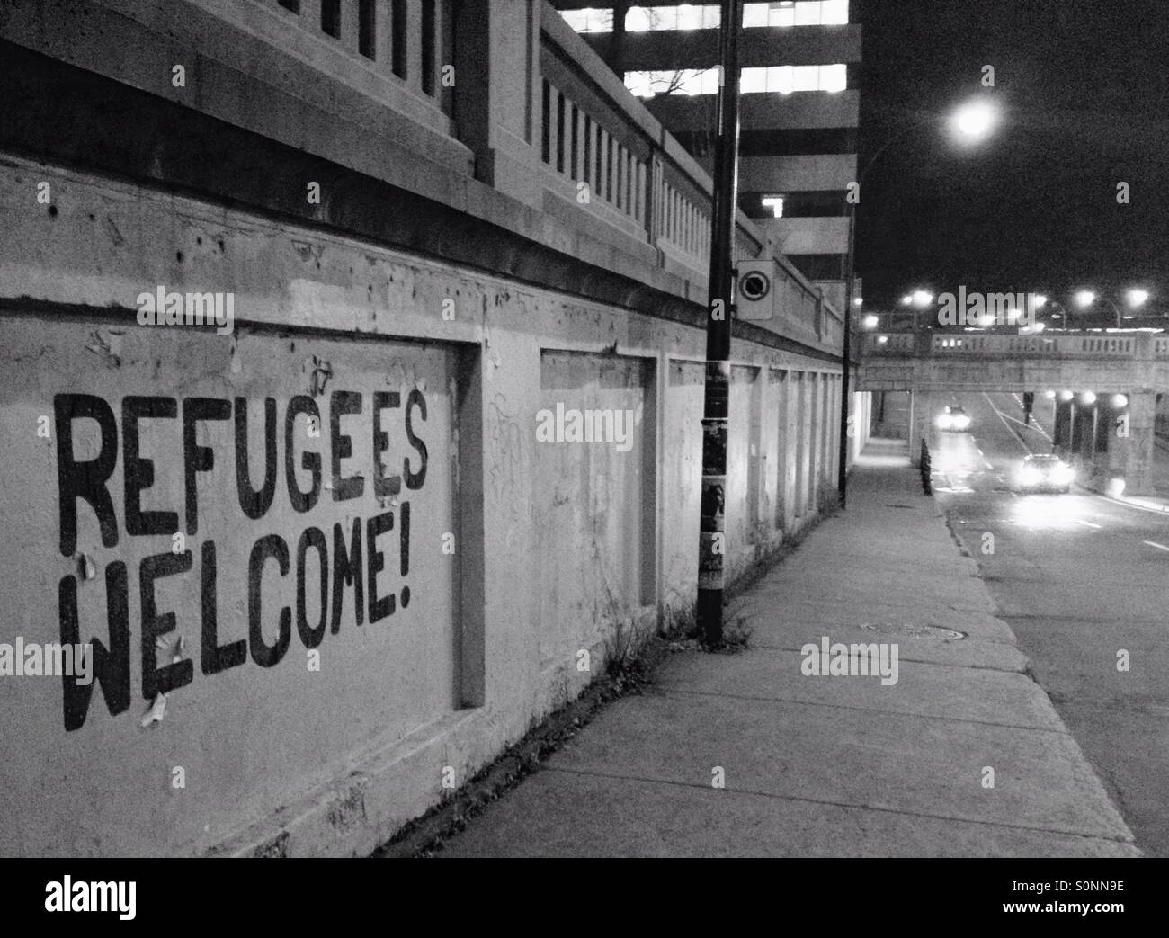Refugees welcome sign Montreal Stock Photo