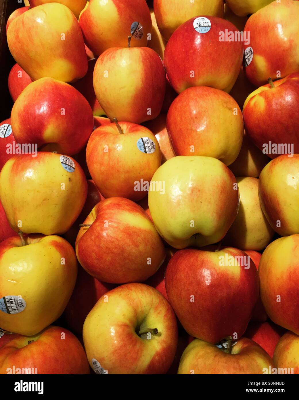Ambrosia apples for sale at the grocery store Stock Photo Alamy